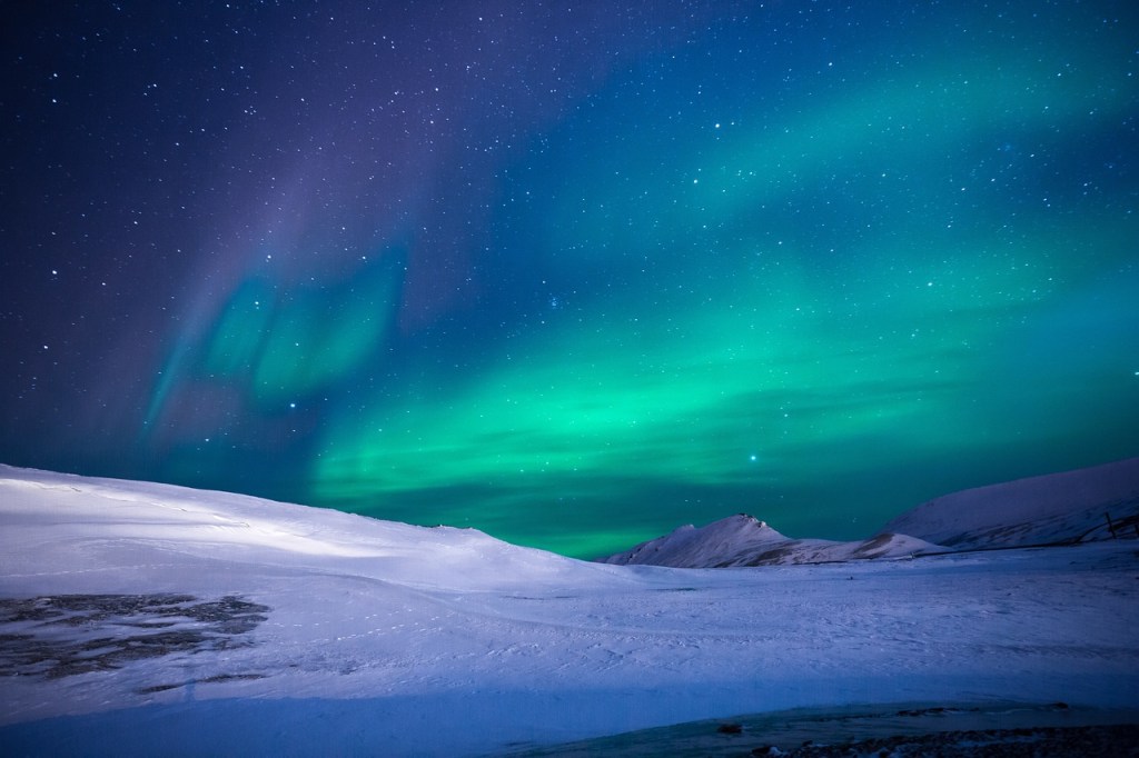 Green and blue lights across the sky. Aurora Borealis